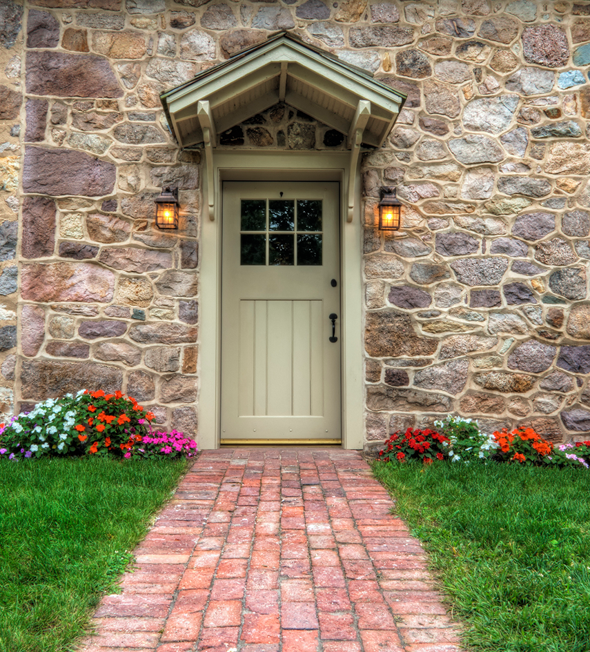 Stone house entrance with flowers