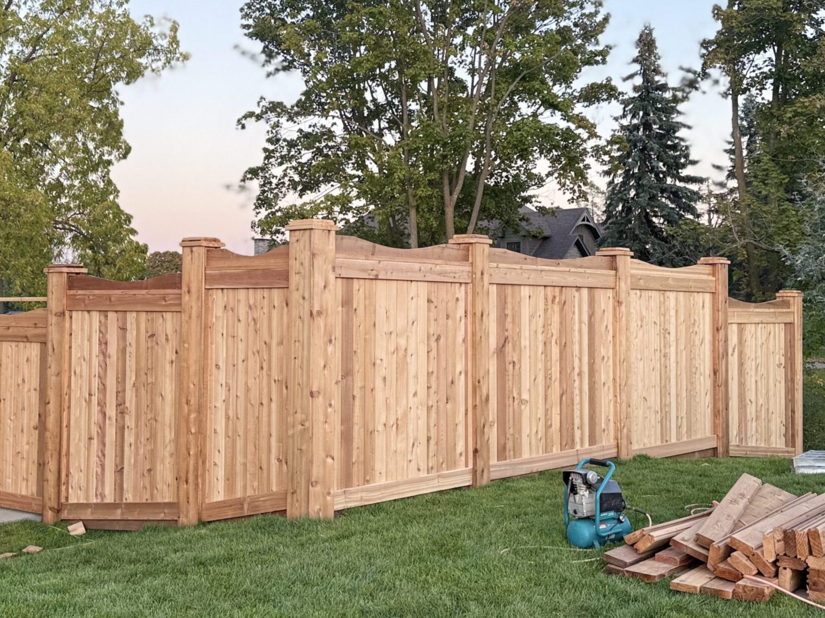 New wooden privacy fence in backyard