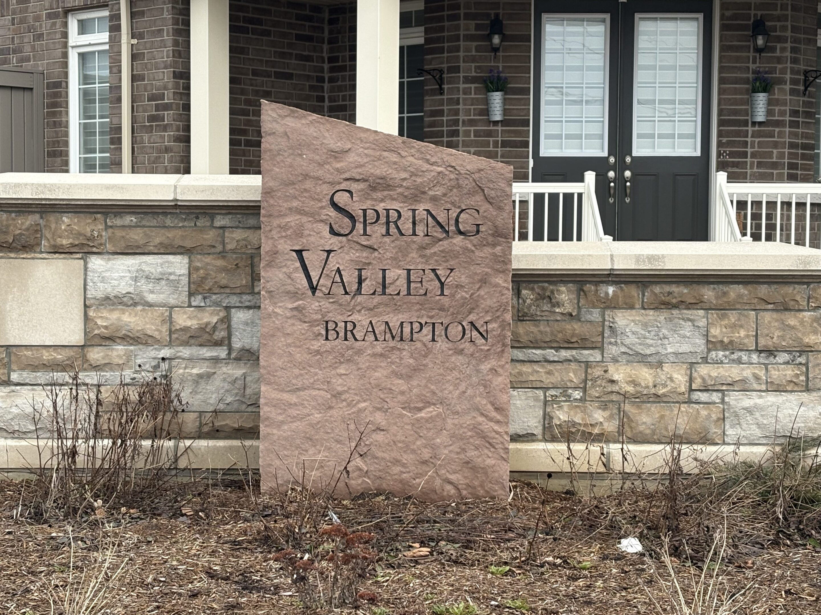 Stone sign reading "Spring Valley Brampton